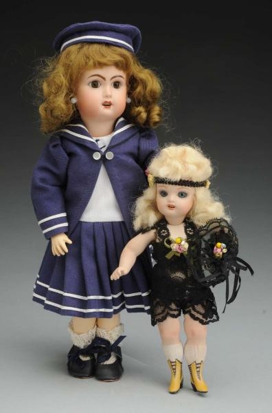 LOT OF 2: REPRODUCTION DOLLS.                     
