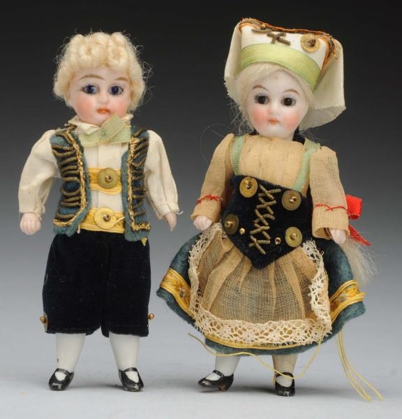 PAIR OF GERMAN ALL-BISQUE DOLLS.                  