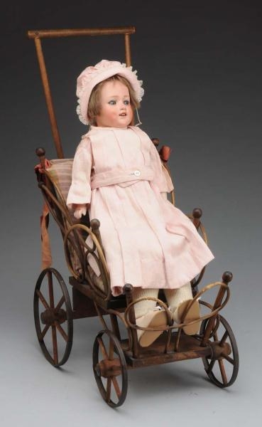 HEUBACH “DOLLY DIMPLE” IN CARRIAGE.               