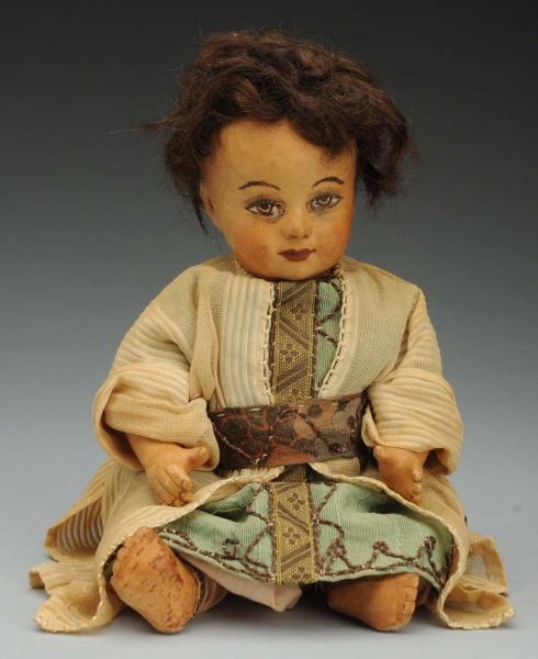UNUSUAL LEATHER BABY DOLL.                        