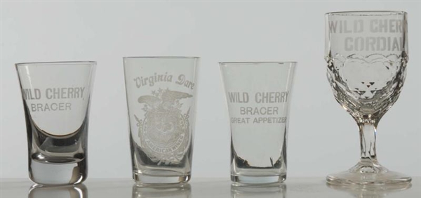 LOT OF 4: SMALL ADVERTISING GLASSES.              