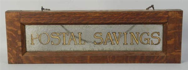 FRAMED GLASS POSTAL SAVINGS HANGING SIGN.         