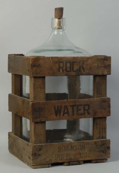 ROCK WATER WOODEN CRATE WITH BOTTLE.              