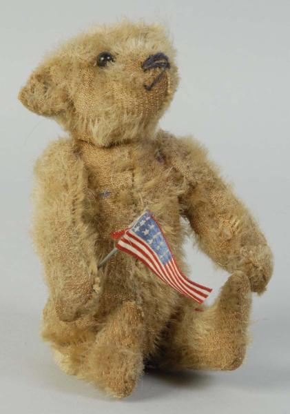 SMALL TEDDY BEAR WITH FLAG.                       