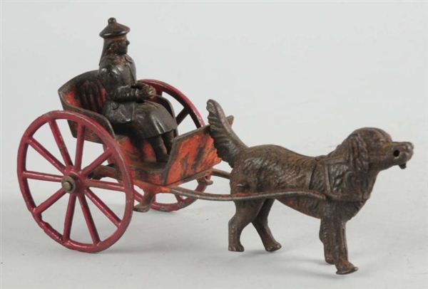 AMERICAN MADE CAST IRON DOG PULLING CART.         