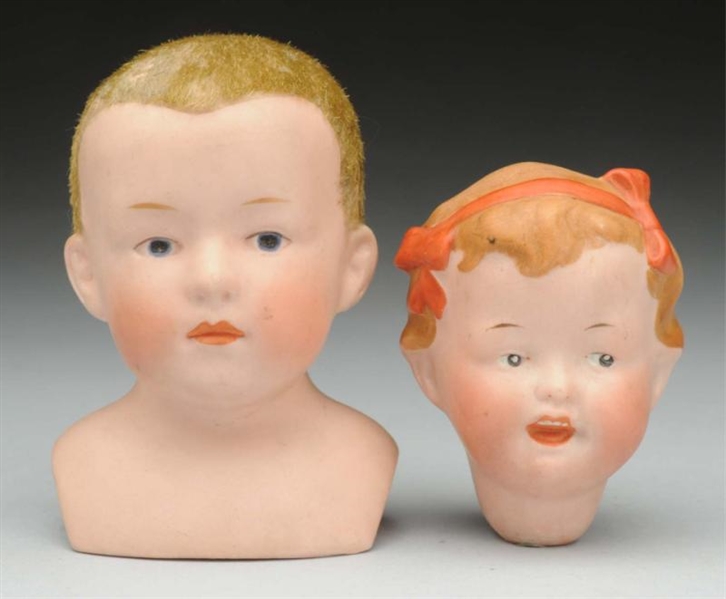 LOT OF 2: GERMAN BISQUE DOLL HEADS.               