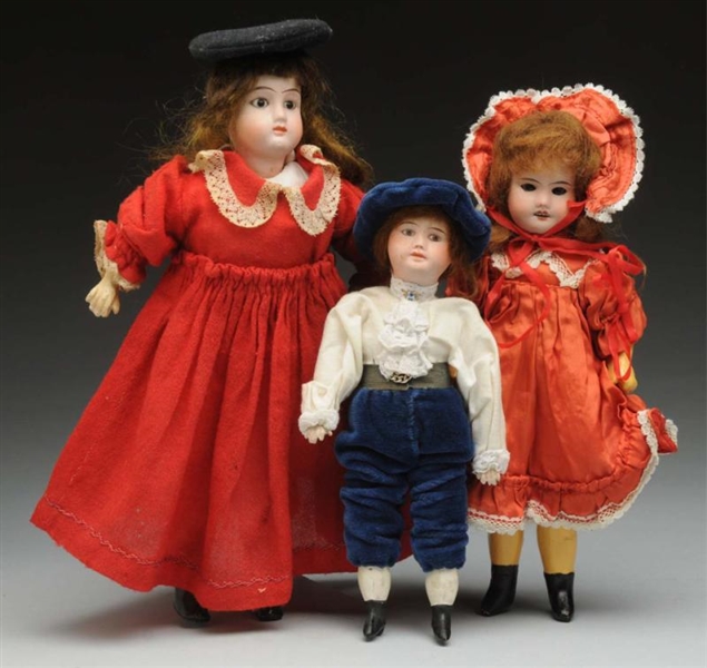 LOT OF 3: BISQUE DOLLS.                           
