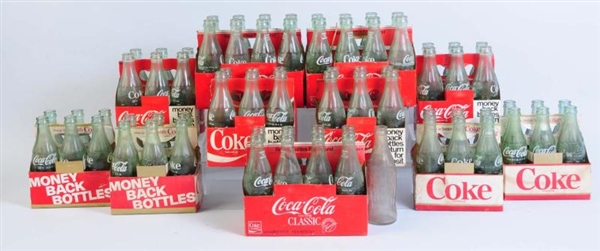 LOT OF COCA-COLA BOTTLES WITH CARDBOARD CARRIERS. 