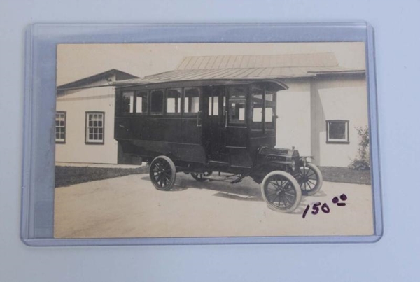 REAL PHOTO POSTCARD OF A VERY EARLY BUS.          