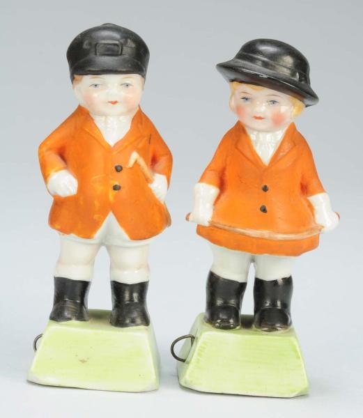 LOT OF 2: PORCELAIN BOY & GIRL IN RIDING OUTFITS. 