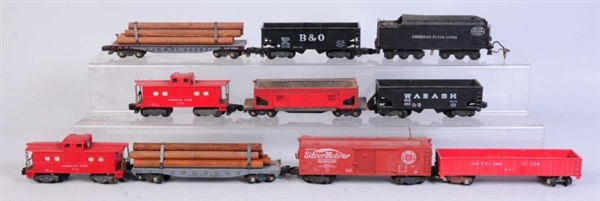 LOT OF 9: AMERICAN FLYER FREIGHT CARS & TENDER.   