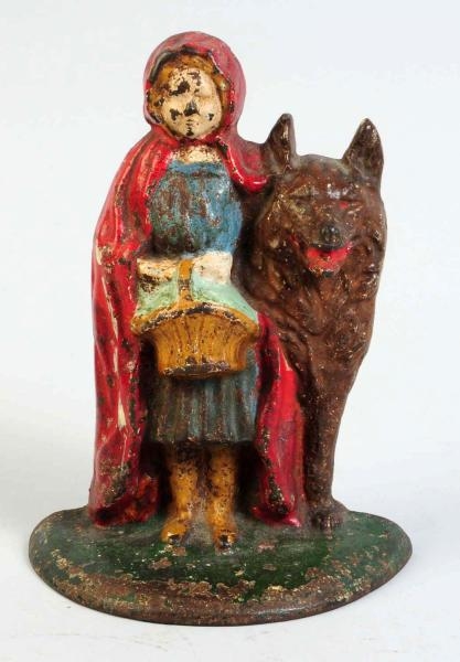 CAST IRON RED RIDING HOOD WITH WOLF DOORSTOP.     