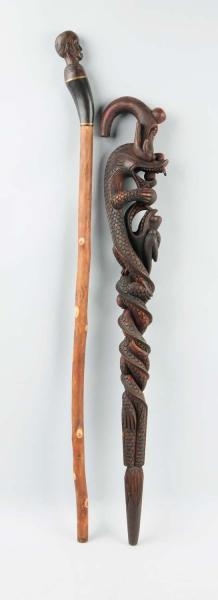 LOT OF 2: HEAVILY CARVED CANES.                   