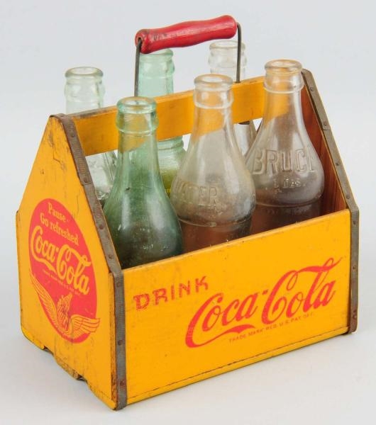 COCA-COLA WOODEN CARRIER WITH 6 BOTTLES.          