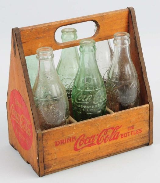COCA-COLA WOODEN CARRIER WITH 6 BOTTLES.          