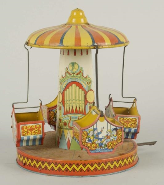 CHEIN TIN WIND-UP CARNIVAL SWING TOY.             