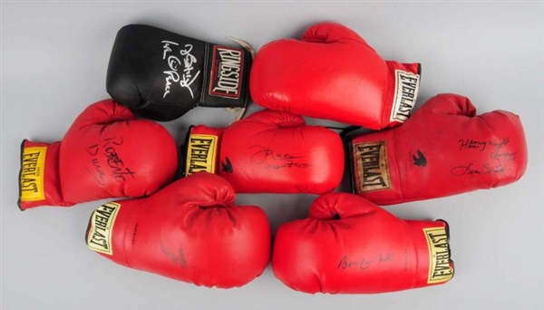LOT OF 7: AUTOGRAPHED BOXING GLOVES.              