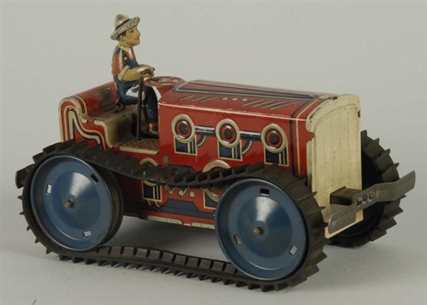MARX TIN WIND-UP TRACTOR TOY.                     