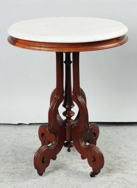 ROUND MARBLE-TOP TABLE.                           