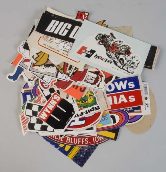 LOT OF AUTOMOBILE ADVERTISING STICKERS.           
