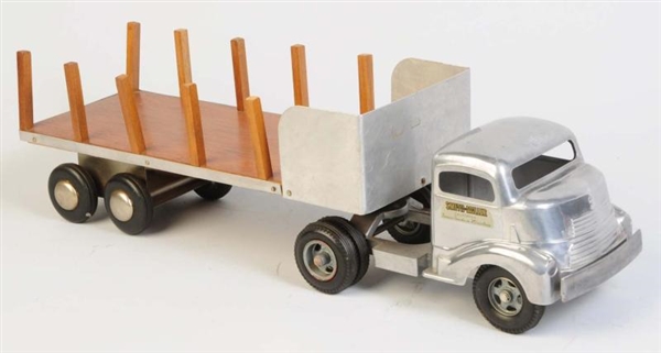 PRESSED STEEL SMITH MILLER STAKE BACK TRUCK.      