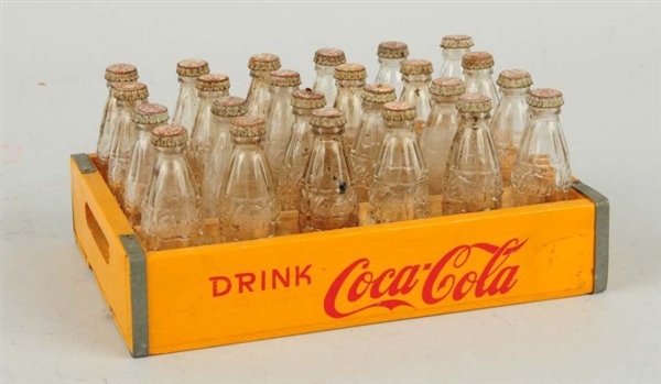 MINIATURE COCA-COLA CARRIER WITH BOTTLES.         