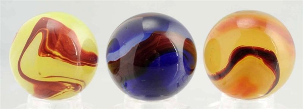 LOT OF 3: AKRO AGATE OXBLOOD MARBLES.             
