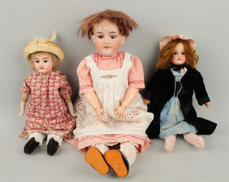LOT OF 3: A.M. GERMAN BISQUE HEAD DOLLS.          