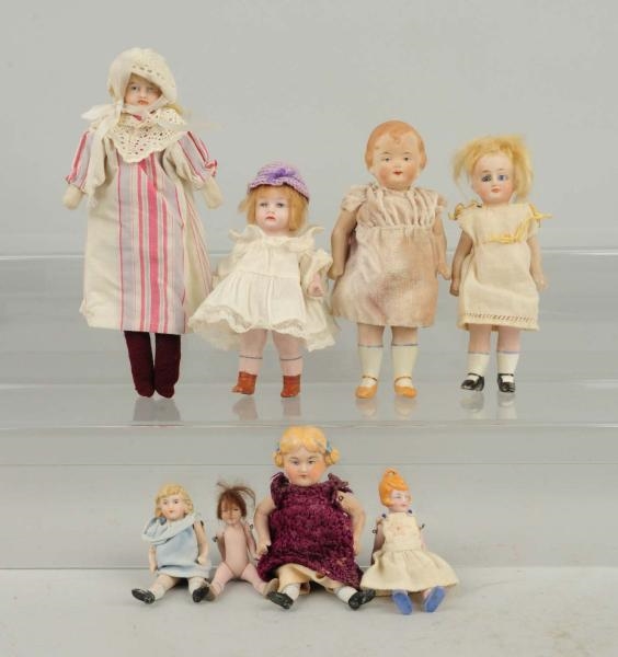 LOT OF 8: SMALL BISQUE DOLLS.                     