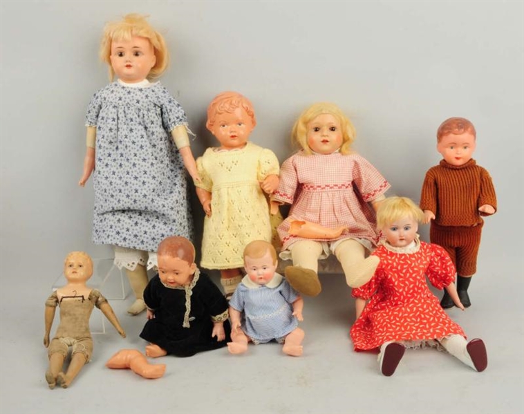 LOT OF 8: CELLULOID & BISQUE HEAD DOLLS.          