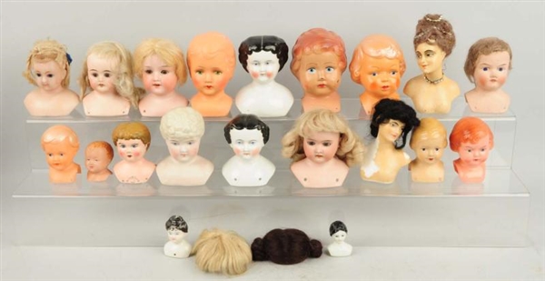 LARGE ASSORTMENT OF DOLL HEADS.                   