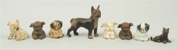 LOT OF 8: ASSORTED CAST IRON DOG PAPERWEIGHTS.    