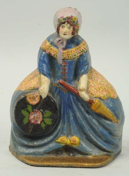 CAST IRON LADY WITH HAT BOX & PARASOL DOORSTOP.   