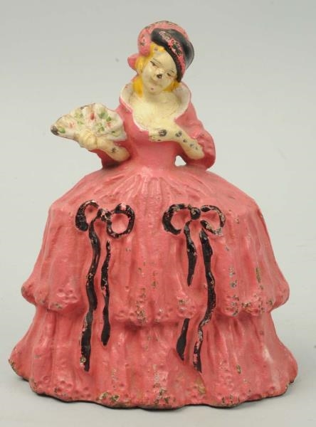 CAST IRON LADY IN HOOPED SKIRT WITH BOWS DOORSTOP 