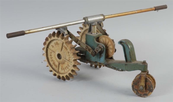 CAST IRON TRACTOR LAWN SPRINKLER.                 