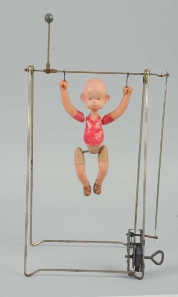 JAPANESE CELLULOID  HENRY ON THE TRAPEZE TOY.     