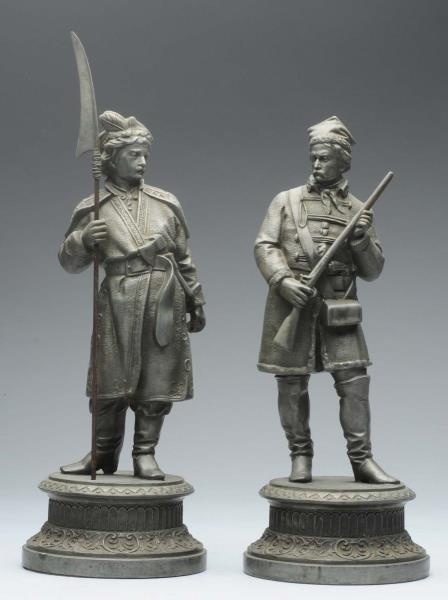 LOT OF 2: METAL SOLDIER STATUES.                  