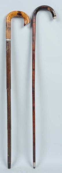 PAIR OF CROOK HANDLE CANES WITH SILVER ACCENTS.   