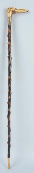 CARVED STAG HANDLED GREYHOUND CANE.               