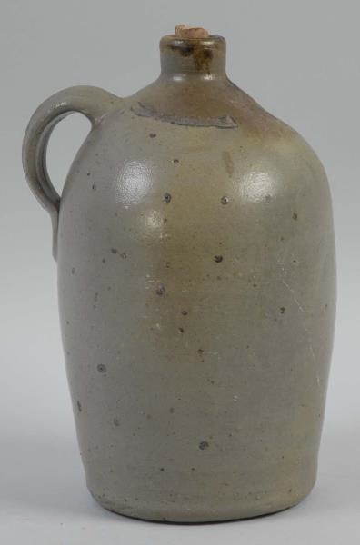EARLY PRIMITIVE STONEWEAR JUG WITH HANDLE.        