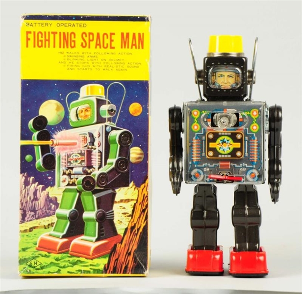 BATTERY-OPERATED FIGHTING SPACE MAN.              