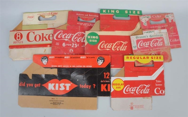 LOT OF MOSTLY COCA-COLA CARDBOARD CARRIERS.       