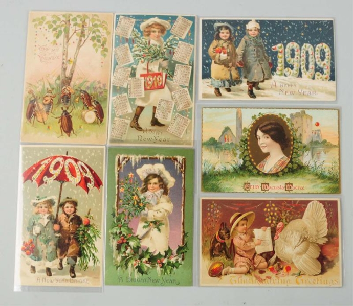 LOT OF 7: YEAR DATES HOLD-TO-LIGHT POSTCARDS.     