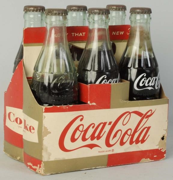1960S COCA-COLA CARRIER WITH FILLED BOTTLES.      