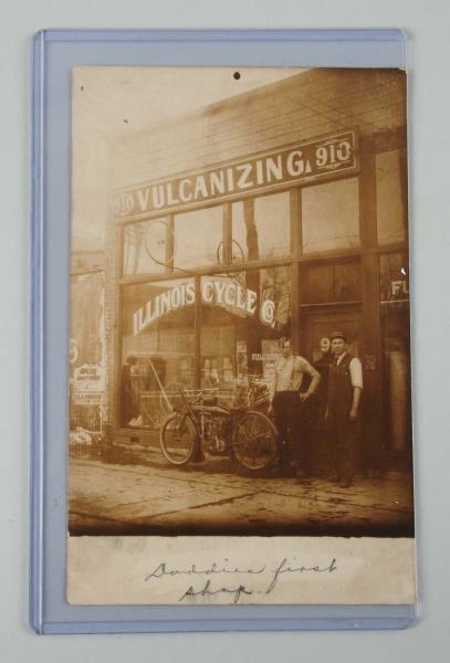 MOTORCYCLE SHOP WITH INDIAN MOTORCYCLE RPPC.      