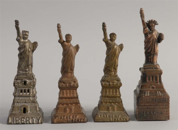 LOT OF 4: STATUE OF LIBERTY STILL BANKS.          