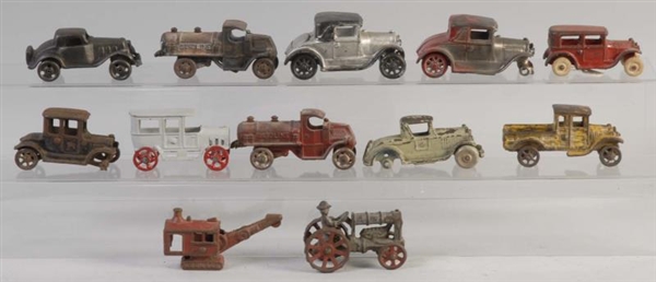 LOT OF 12: MISC. SMALL CAST IRON VEHICLES.        