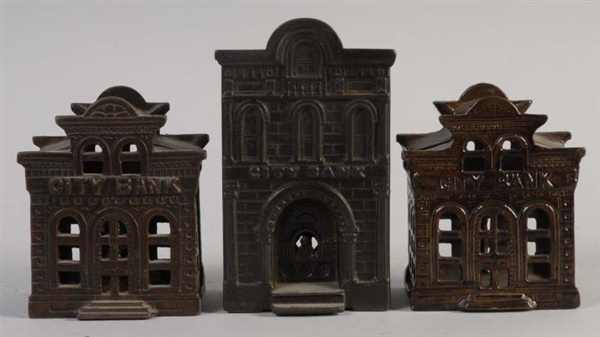 LOT OF 3: CAST IRON BUILDING BANKS.               