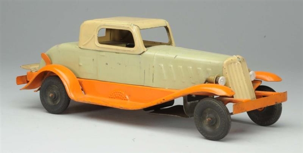 PRESSED STEEL GIRARD WIND-UP AUTOMOBILE TOY.      