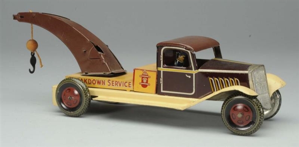 WELLS TIN WIND-UP TOW TRUCK TOY.                  